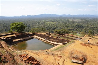 Water basin on the lion rock, behind the jungle landscape, ruined city of Sigiriya, Central