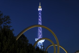 The radio tower shines in the colours of the IFA (Internationale Funkausstellung) on the exhibition