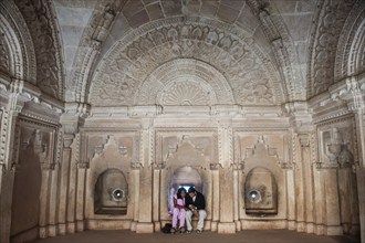 Indian couple sitting in a niche, palace in Gwalior Fort, Gwalior, Madhya Pradesh, India, Asia