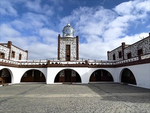 View of inner courtyard of building complex of lighthouse Faro de la Entallada from 50s year 1953