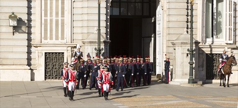 Marching soldiers in traditional dress uniform, Palacio Real royal palace, Madrid, Spain, Europe