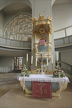 Altar with decorations, crucifix and candles, St Gumbert's Church, interior view, Ansbach, Middle