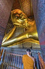 Reclining Buddha with praying monk in Wat Pho temple, Buddhism, religion, world religion,