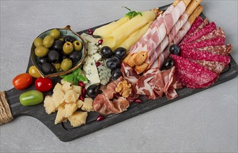 Appetizer, assortment, set, sausage, and cheese, on a wooden board, top view, no people