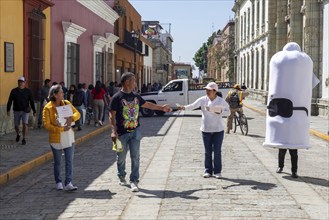 Oaxaca, Mexico, Health workers walk the streets handing out free condoms as part of their fight