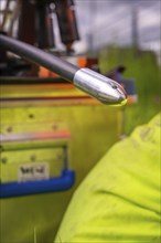 Close-up of a cable with a metal tip while working in a meadow, fibre optic installation, Calw