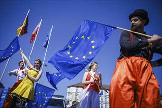 People pose with European flags on the occasion of the 'Ä®20th anniversary of Poland's accession to