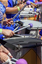 Drums played by women during a street carnival performance in the city of Belo Horizonte, Minas