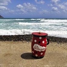 Red outdoor bar table, jug, bar with sea view, beach bar, Cabo de Gata Natural Park,