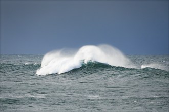 Large waves breaking on open water of the North Sea off the coast of Scotland