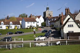 Pond and historic buildings in the attractive tourist honeypot village of Finchingfield, Essex,