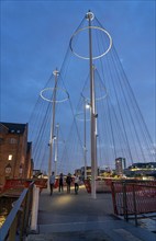 Cyclists on the Cirkelbroen cycle and pedestrian bridge, over the harbour, in the Christianshavens