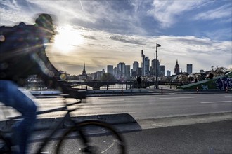 Skyline of Frankfurt am Main, skyscrapers, cyclists on the Flößerbrücke, Hesse, Germany, Europe