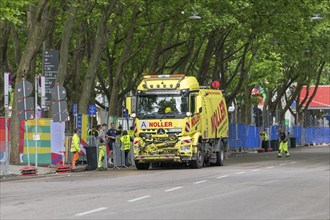 Sweeper cleans the road in front of the MHPArena in Stuttgart, Baden-Württemberg, Germany, Europe