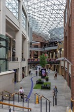 Bright interior of a modern shopping centre with glass ceiling, Belfast