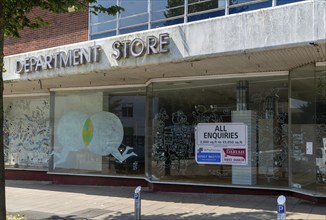 Closed Westgate department store shop with All Enquiries estate agency sign, Lowestoft, Suffolk,