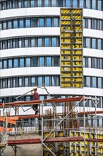 Construction site, construction of an office building, scaffolding, concrete worker, Düsseldorf,