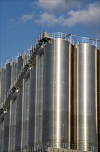 Stainless steel tanks of a large silo facility in Duisburg inland harbour, Duisburg-Neuenkamp, for