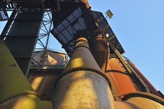 Metal industrial plant with old pipes and steel structures showing traces of rust, Landschaftspark