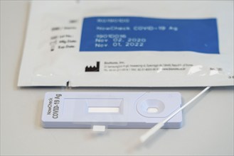 Covid-19 rapid test, antigen test, the abrasion of the swab is dissolved in a liquid and applied to