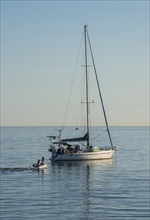 Sailboat at anchor on a calm sea, Baltic Sea off Ystad, Skåne County, Sweden, Scandinavia, Europe