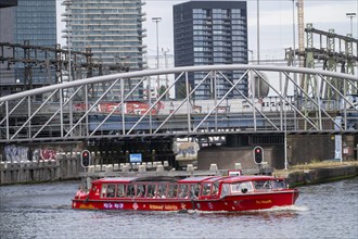 Canal cruise, in the Oosterdok, excursion boat on the way to the river IJ, Amsterdam Netherlands