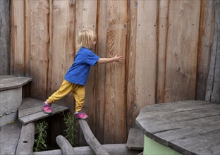 Little girl, 3 years, blonde, balancing, gymnastics, playing, adventure playground, playground,