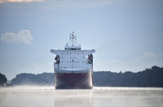 RoRo cargo ship Super Fast Levante travelling through the Kiel Canal at sunrise, Kiel Canal,