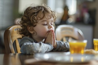 Young boy child praying at kitchen table before meal. Generative Ai, AI generated