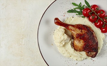 Fried duck shank, cauliflower puree, cherry tomatoes, homemade, no people