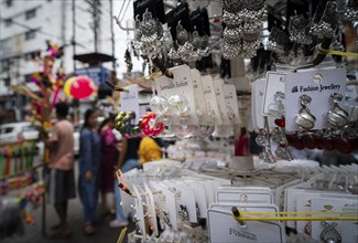 Women buys jewelleries at street market ahead of Durga Puja festival on October 7, 2024 in