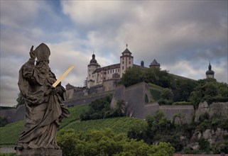 View from the old Main bridge to the statue of St Kilian, in the background Marienburg fortress,