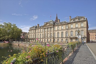 Historic Palais Rohan built in 1742 and Pont Sainte-Madeleine bridge with floral decoration over