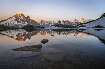 Evening mood, mountain landscape at sunset, alpenglow, water reflection in Lac Blanc, mountain