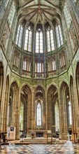 Impressive church interior with high arches and large windows, Le Mont-Saint-Michel