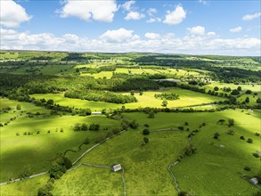 Farms and Fields over Bainbridge Village from a drone, Leyburn, North Yorkshire, England, United