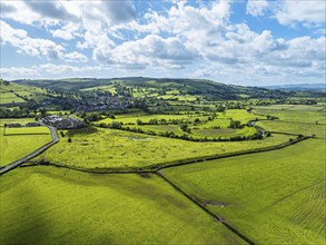 Farms and Fields over Cononley and River Aire from a drone, Keighley, North Yorkshire, England,