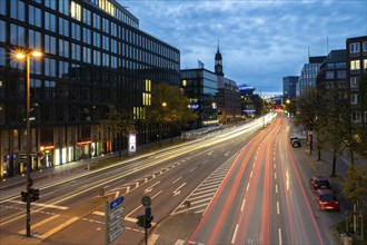 View from Rödingsmarkt to Ludwig-Erhard-Straße and the main church St. Michaels (Michel) at blue