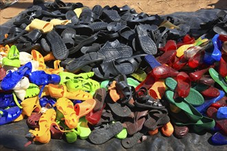 South Ethiopia, market in Jinka, market day, trade with plastic sandals, plastic shoes, market