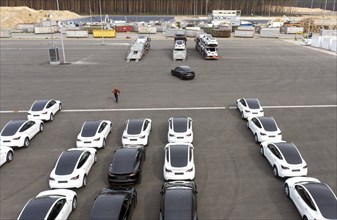 Tesla Y models produced in the Tesla Giga Factory are loaded onto car transporters, Grünheide, 24