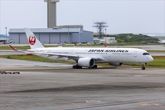 An Airbus A350-900 aircraft of JAL Japan Airlines with the registration JA14XJ at Okinawa Airport