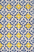 Detailed view of a facade adorned with azulejo tiles on an old house in Porto, Portugal, Europe