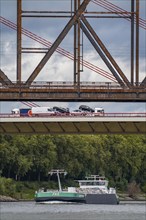 The Beeckerwerth Rhine bridge of the A42 motorway, truck traffic, in front of it the Haus-Knipp