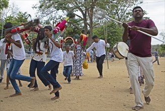 Sri Lankan pilgrims dancing in the Buddhist temple Ruhunu Maha Kataragama Dewalaya, Kataragama, Uva