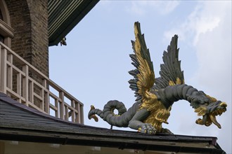 Close-up of a gold-blue-red painted dragon statue, historic large pagoda, Royal Botanic Gardens