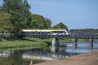 Regional railway crosses the Leopolskanal on the bridge near Riegel am Kaiserstuhl,