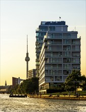 View from the Spree to an apartment building at the East Side Galery and the TV tower on the