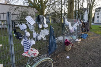 Gift fence with donations for the homeless and needy, food, hygiene articles, clothing, in Essen