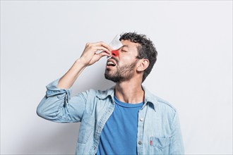 Person with irritated nose on isolated background, man with red nose cold, concept of person with