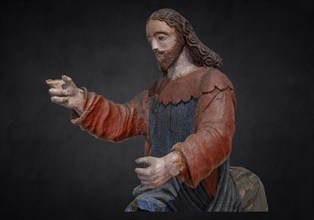 Christ on the palm donkey, on a dark background, detail, wooden figure from around 1400, Museum